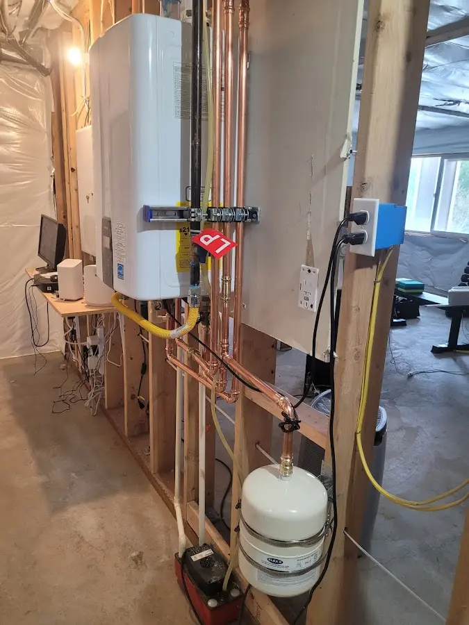 Licensed plumber repairing a kitchen sink in Algona