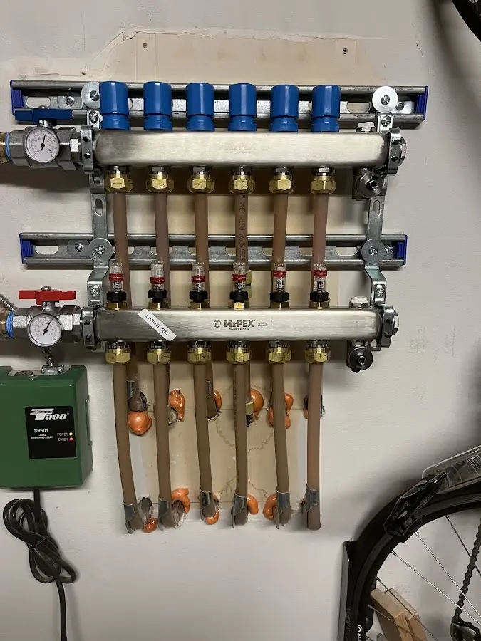 Plumber performing Gas Line Installation at a residential property in Algona